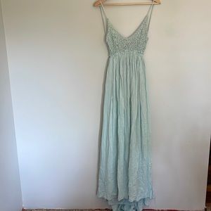 Crochet top maxi dress with open back and frayed hem.